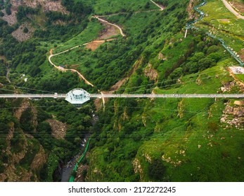 Dashbashi, Georgia - 19th June, 2022: Aerial Fly Over Diamond Shape Platform On Glass Bridge Over Scenic Dashbashi Valley In Georgia Countryside. Famous Modern Bridge Over Valley In Caucasus