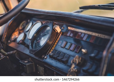 The Dashboard Of An Antique Truck. Key In The Ignition.