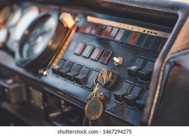 The Dashboard Of An Antique Truck. Key In The Ignition.