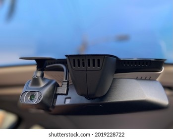 A dashboard camera or simply dashcam, also known as car digital video recorder, is an onboard camera that continuously records the view through a vehicle's front windscreen and sometimes rear or other