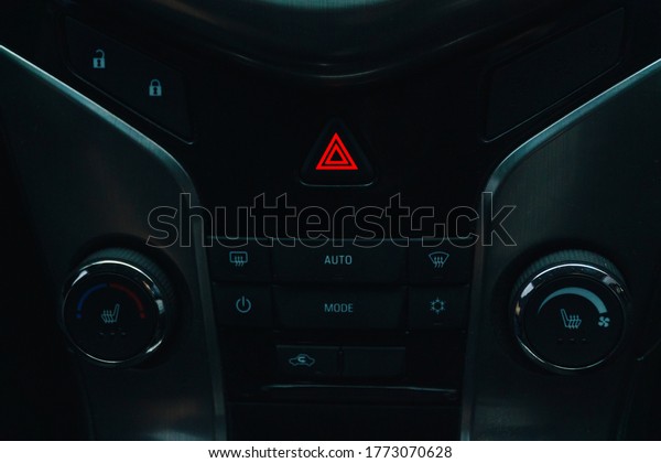 dashboard in a car with\
emergency lights on