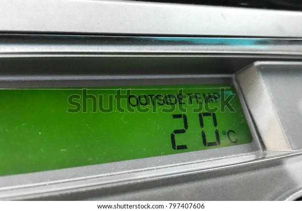 Dashboard of a car, in\
Malaysia show outside temperature, 20 degree celcius, very mild for\
a tropical country.