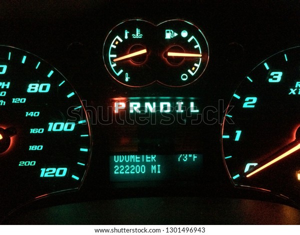 Dashboard gauge lights with odometer reading\
222200 miles.