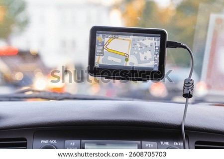 Dashboard with Navigation Device and Audio Player in a Moving Vehicle