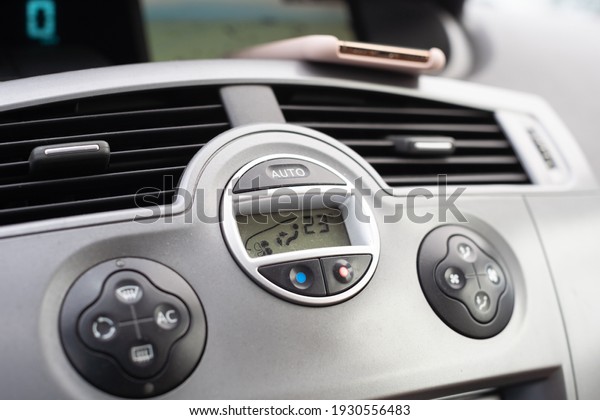 Dashboard in a passenger car. Heating and air\
conditioning control\
buttons.
