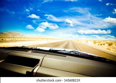 Dashboard Seen While Driving Hot Desert Road