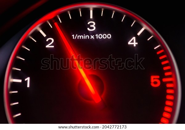 Dashboard with speedometer, tachometer, odometer.\
Car detailing. Car dashboard. Dashboard details with indication\
lamps.Car instrument panel.Modern interior.Close up shot.Blurred\
image.