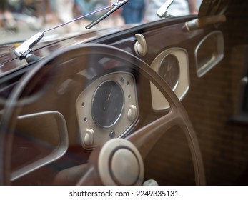 Dashboard and steering wheel of old-timer car