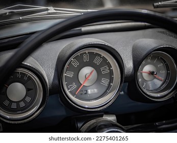 Dashboard and steering wheel of old-timer car