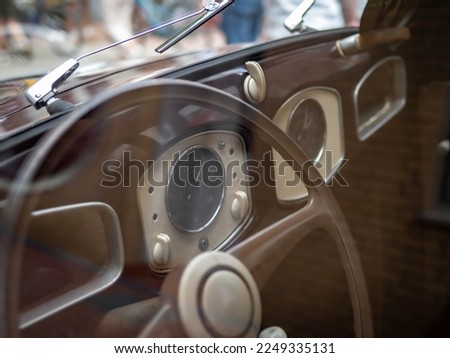 Dashboard and steering wheel of old-timer car