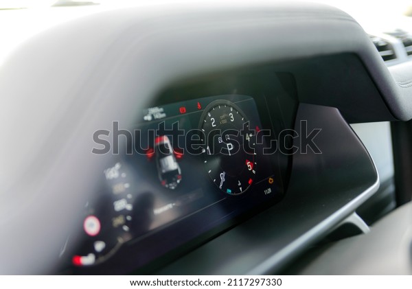 Dashboard with tachometer. Car detailing. Car\
dashboard. Dashboard details with indicator lamps. Car instrument\
panel. Modern interior. Close up\
shot.