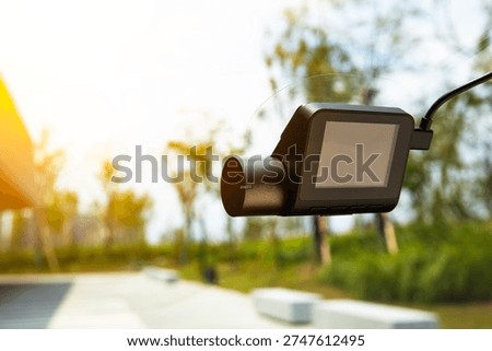 Dashcam attached to the windshield of the car