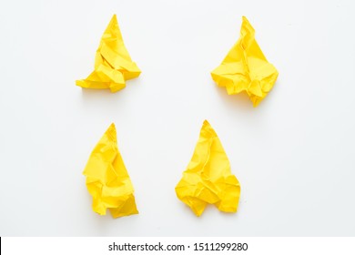 Dashed Hopes And Destroyed Expectations. Four Yellow Crushed Paper Airplanes Isolated On White Background. Copy Space.