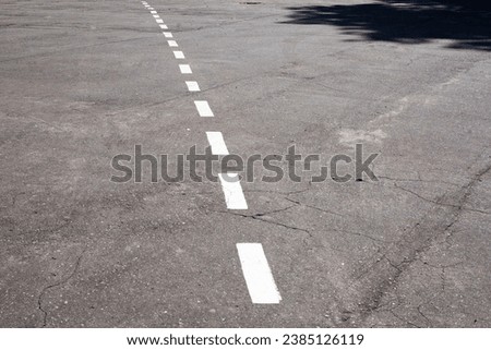 Dashed line. Markings on the road. White dotted line on the asphalt. Road markings on the highway.