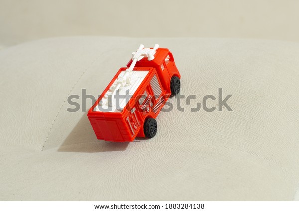 dashing-looking fire engine toy in
red