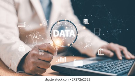 Data analysis and AI technology concept. Businessman using magnifying glass over digital data interface. Analytics, information security, artificial intelligence and smart business decision making.