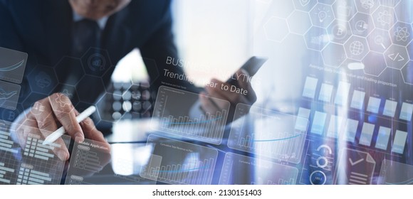 Data analysis, Business Intelligence concept. Businessman working on digital tablet, analyzing financial graph chart, business sales report and digital marketing data on futuristic virtual screen
