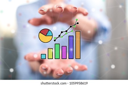 Data analysis concept between hands of a woman in background