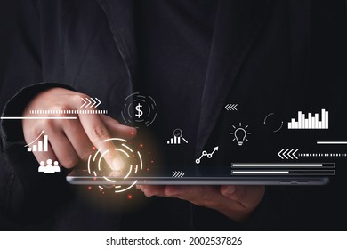 Data analysis concept. Businessman using tablet progress of business and analyzing financial and investment data ,business planning. - Powered by Shutterstock - Get 15% off with code: PIKWIZARD15