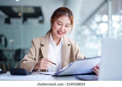 Data Analysis, Plan, Marketing, Accounting, Audit, Portrait Of Asian Business Woman Planning Marketing Using Statistical Data Sheet And Computer To Present Marketing Plan Project At Meeting.