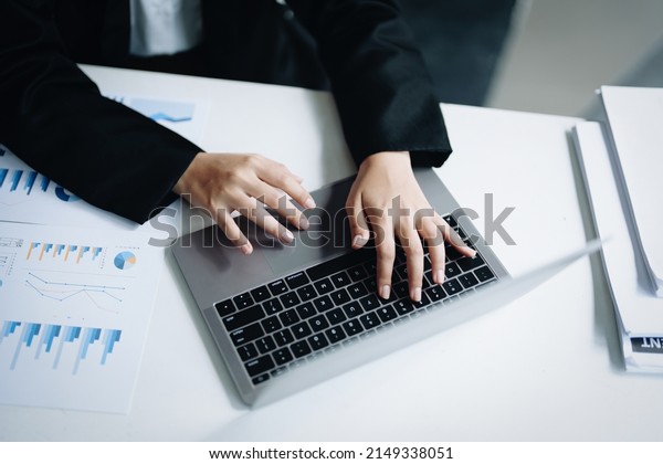 data analysis, plan, marketing, accounting,\
audit, Portrait of asian business woman planning marketing using\
computer and statistical data sheet to present marketing plan\
project at meeting.