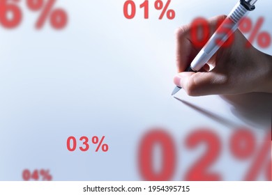 Data analysis. Stock analytics. The stock market. A person writes on a white sheet next to the percentages. Space for the text. The situation on the stock exchange. Statistical data. Info analysis. - Powered by Shutterstock