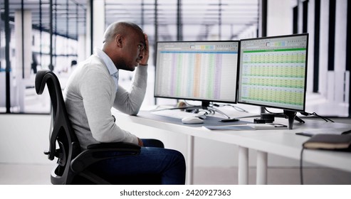 Data Analyst African Man Using Spreadsheet On Computer - Powered by Shutterstock