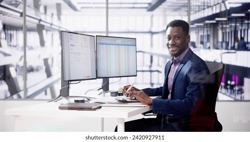 Data Analyst African Man Using Spreadsheet On Computer