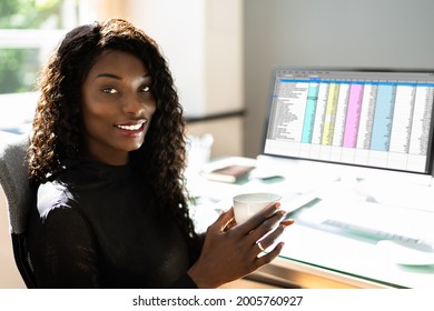 Data Analyst African Woman Using Spreadsheet On Computer