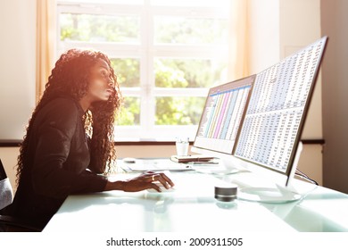 Data Analyst African Woman Using Spreadsheet On Computer