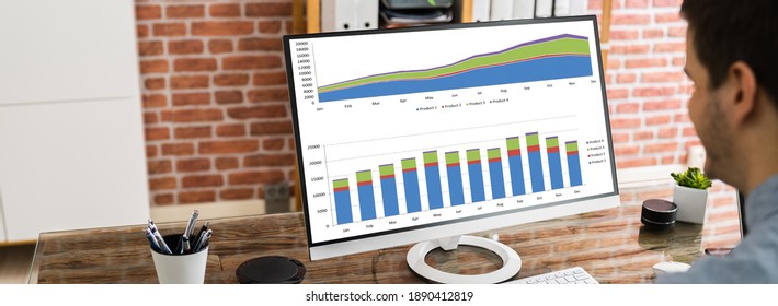 Data Analyst Using Charts And Graphs On Computer
