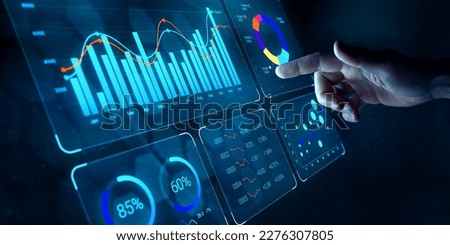 Data analyst working on business analytics dashboard with charts, metrics and KPI to analyze performance and create insight reports for operations management on virtual screen.