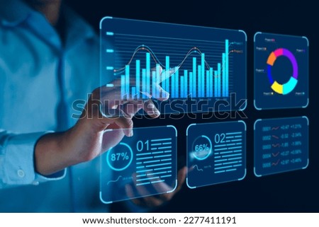 Data analyst working on business analytics dashboard with charts, metrics and KPI to analyze performance and create insight reports and strategic decisions for operations management on virtual screen.