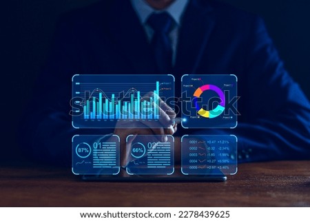 Data analyst working on business analytics dashboard with charts, metrics and KPI to analyze performance and create insight reports and strategic decisions for operations management on virtual screen.