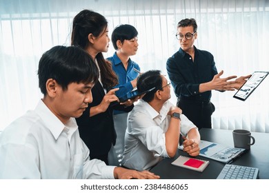 Data analysts team of office worker collaborate on business intelligence BI dashboard to analyze financial, trend, and marketing data using tablet. BI technology and data analysis concept. Prudent
