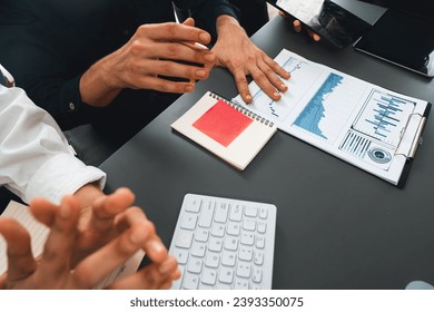 Data analysts team of office worker collaborate on business intelligence BI dashboard to analyze financial, trend, and marketing data. BI software utilization drive business success. Prudent