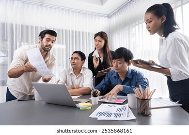 Data analysts team of office worker collaborate on business intelligence BI dashboard to analyze financial, trend, and marketing data. BI software utilization drive business success. Prudent