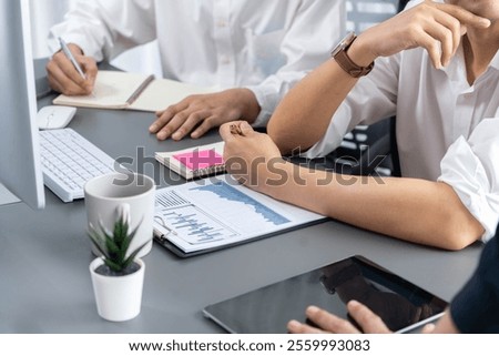 Data analysts team of office worker collaborate on business intelligence BI dashboard to analyze financial, trend, and marketing data. BI software utilization drive business success. Prudent