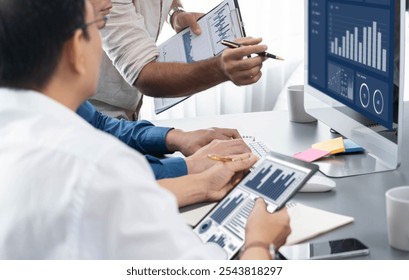 Data analysts team working analyzing business intelligence BI dashboard display on laptop to analyze financial, trend, and marketing data. BI technology and data analysis for business success. Prudent - Powered by Shutterstock