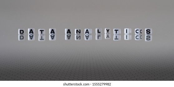 Data Analytics, a concept in black and white letter cubes