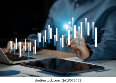 Data analyzing financial technology concept, businessman using laptop to analyze chart data and information management system, database  for finance, strategy, planning, operations, marketing
