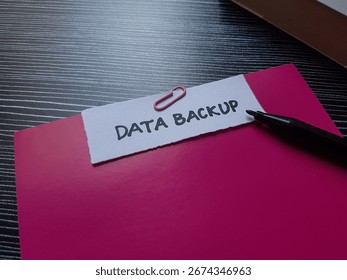 Data backup writting on table background.