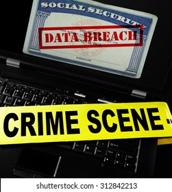 Data Breach Text On Social Security Card With Crime Scene Tape On Laptop Computer