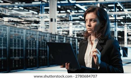 Data center admin creating digital twin scan to optimize server load balancing. Server farm IT specialist using augmented reality visualization to adjust system parameters