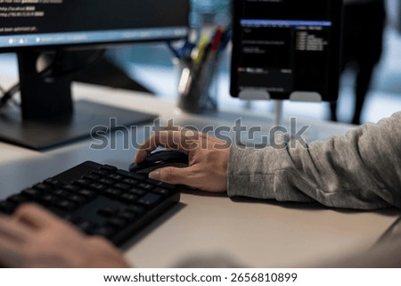 Data center admin typing on keyboard, developing disaster recovery plans. Close up of server hub worker using analytics to monitor performance and predict future infrastructure needs