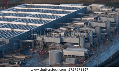 Data center building featuring solar panels and advanced cooling systems