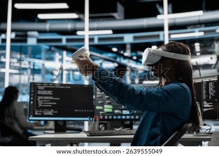 Data center developer uses VR headset and AI technology for machine learning workloads. Server hub specialist using virtual reality and artificial intelligence to perform demanding computing tasks