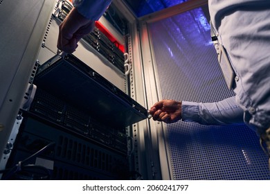 Data Center Employee Upgrading Old Hardware Equipment