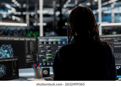 Data center employee using node trees and machine learning algorithms to analyze large datasets. Server room engineer using artificial intelligence to recognize patterns in facility data