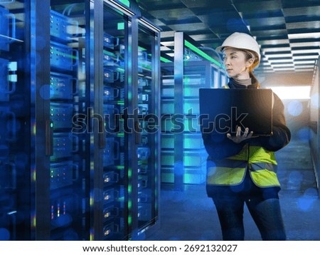 Data center engineer inspects server racks with laptop, ensuring network security, maintenance, and reliable IT infrastructure management.